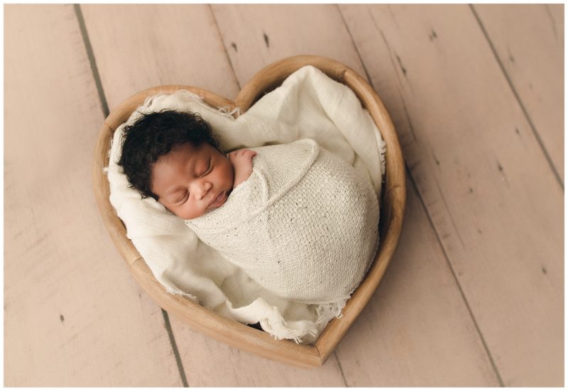 newborn in heart bowl, frisco newborn photographer 