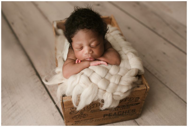 sleeping baby in crate, frisco newborn photographer 