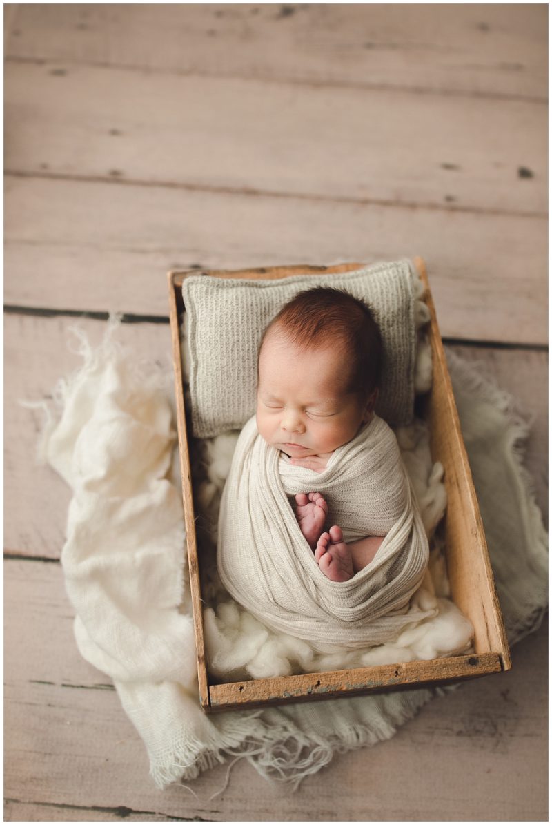 baby in crate, frisco newborn photographer 
