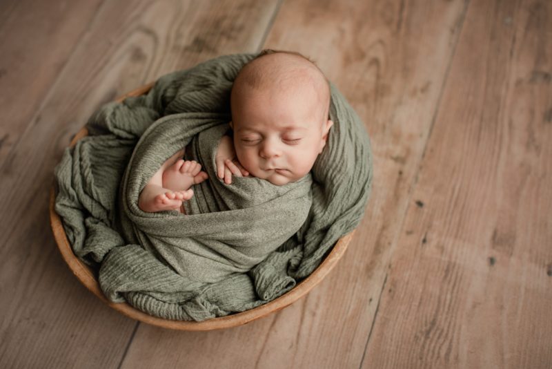 newborn boy in bowl 