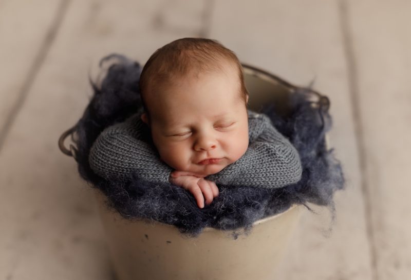 newborn boy bucket pose