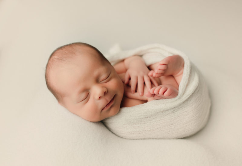 newborn swaddled in white on white blanket, Mckinney Newborn photographer