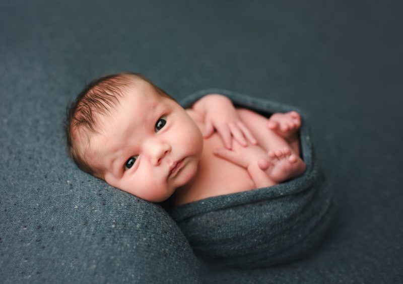 awake newborn swaddled on teal blanket, mckinney newborn photographer
