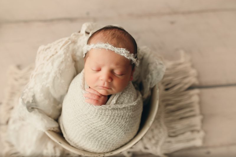 newborn swaddled in cream in bucket, mckinney newborn photos