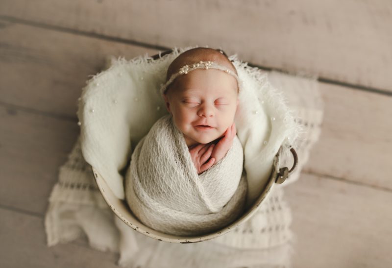 newborn swaddled in white in bucket with white blankets, dallas newborn photos baby zoe
