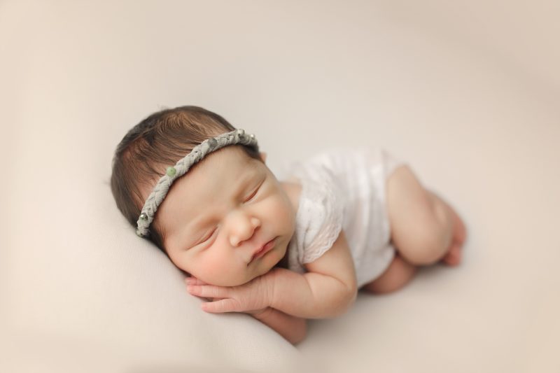 newborn girl sleeping on hands on cream blanket, prosper newborn photo session baby olivia