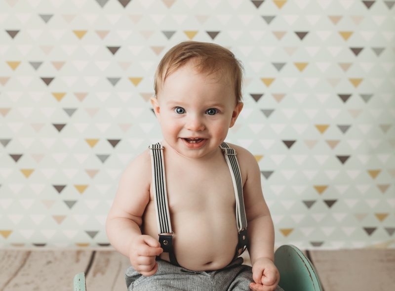 baby sitting up wearing suspenders, baby mini sessions mckinney baby photographer