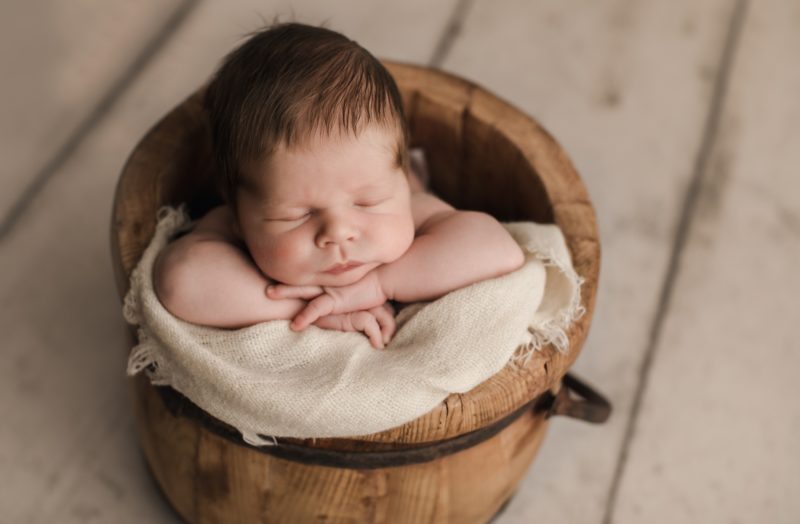newborn sleeping on bucket, mckinney newborn photography session baby camden