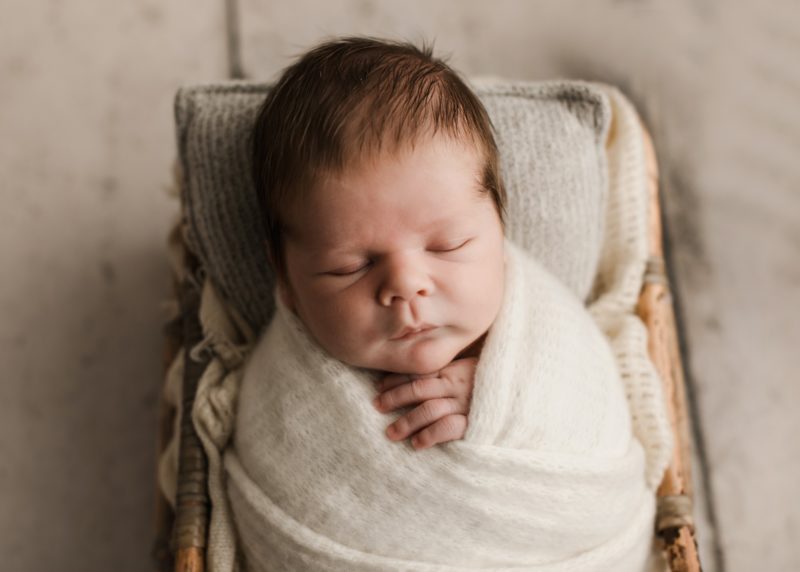 newborn swaddled in white in crate, mckinney newborn photography session baby camden