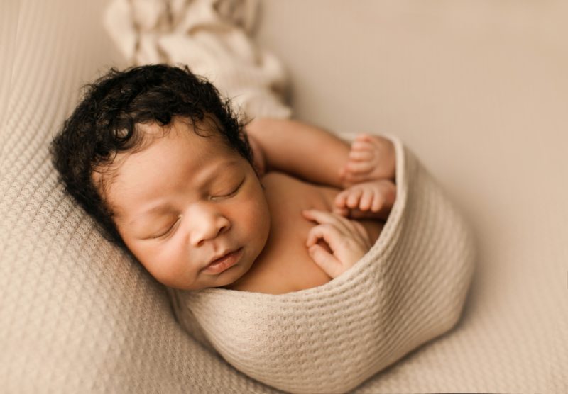 newborn boy swaddled in cream on blanket_prosper newborn photography session baby crew